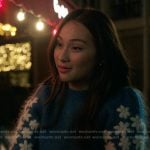 Belly’s blue sweater with floral sleeves on The Summer I Turned Pretty