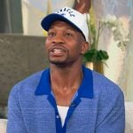 Jonathan Majors’ blue knit polo on Tamron Hall Show