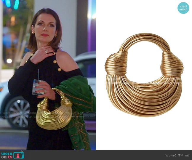 Bottega Veneta Double Knot Bag in Gold worn by Julia Lemigova (Julia Lemigova) on The Real Housewives of Miami