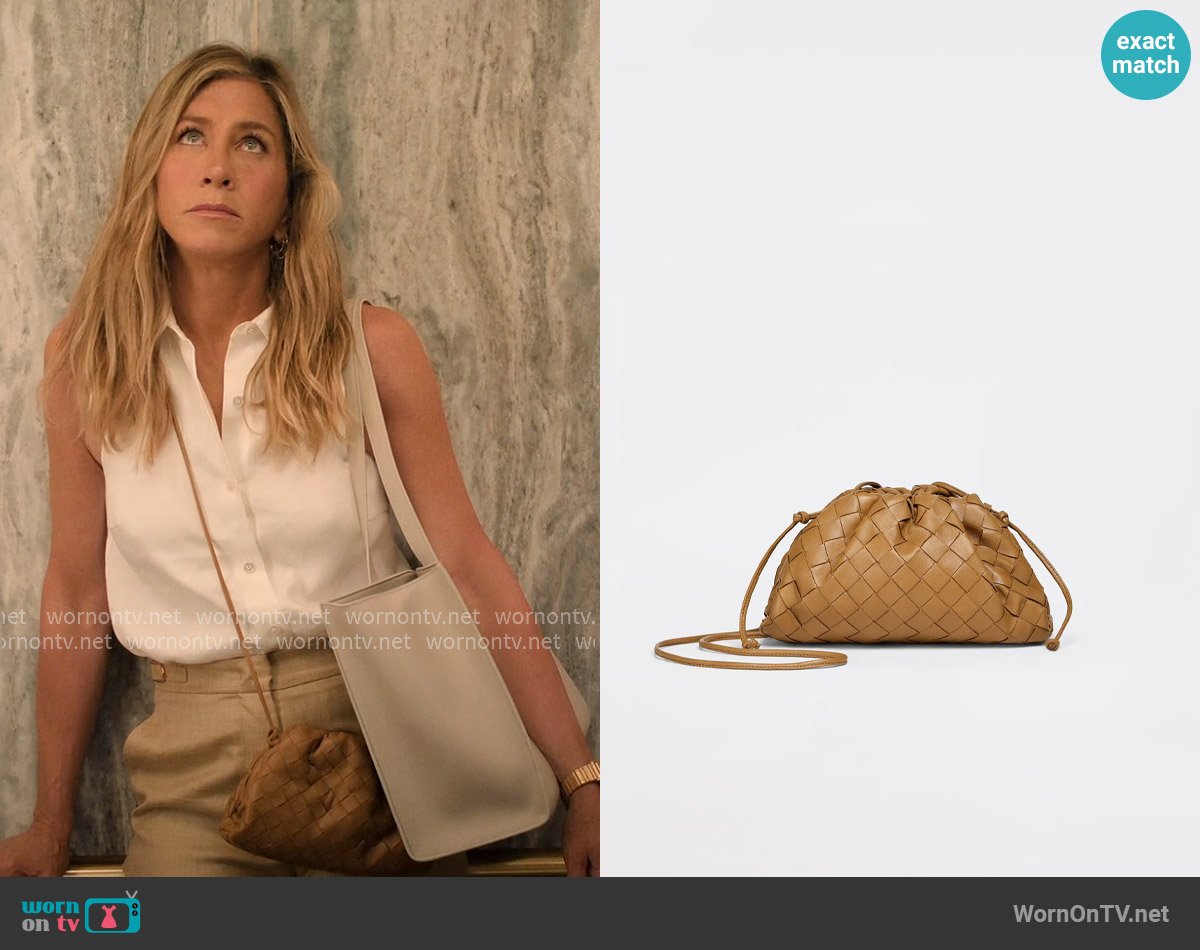 Bottega Veneta Mini Pouch in Caramel worn by Alex Levy (Jennifer Aniston) on The Morning Show