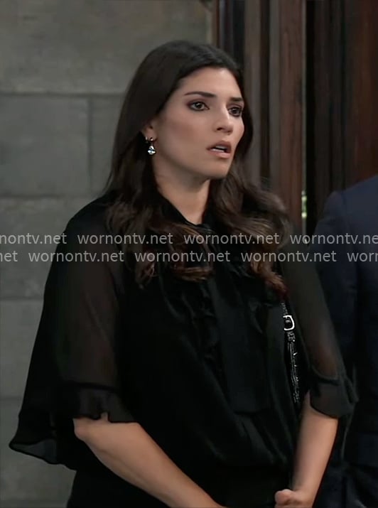 Brook Lynn’s black ruffled blouse on General Hospital