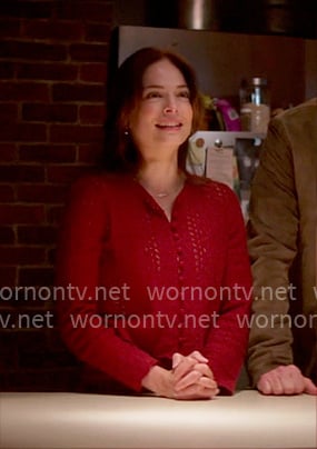 Cassandra’s red pointelle knit cardigan on Murder in a Small Town