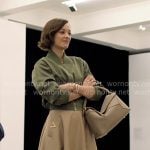 Celine’s green bomber jacket and beige skirt on The Morning Show