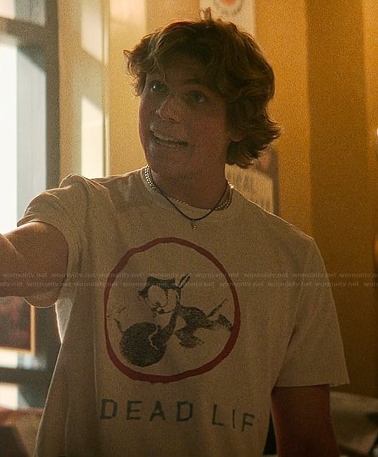 Charlie's white graphic tee on The Runarounds