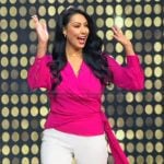 Christine’s pink wrap top on Tamron Hall Show