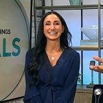 Elizabeth Werner’s navy v-neck dress on CBS Mornings