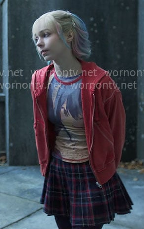 Enid's anime graphic tee and plaid skirt on Wednesday