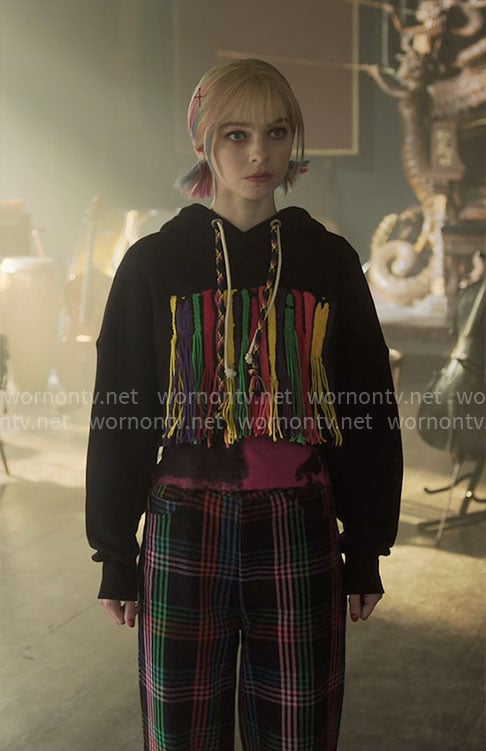 Enid's fringed hoodie and plaid pants on Wednesday
