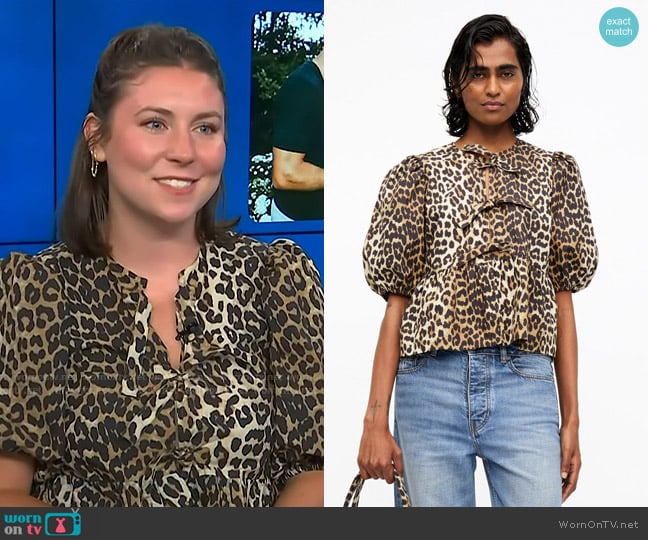 Ganni Leopard Cotton Poplin Peplum Tie Blouse worn by Reagan Baylee on Access Hollywood