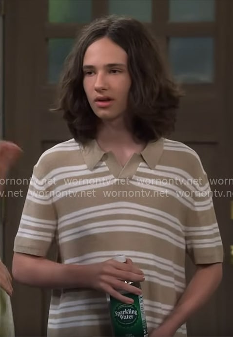 Grover's beige striped polo shirt on The Neighborhood