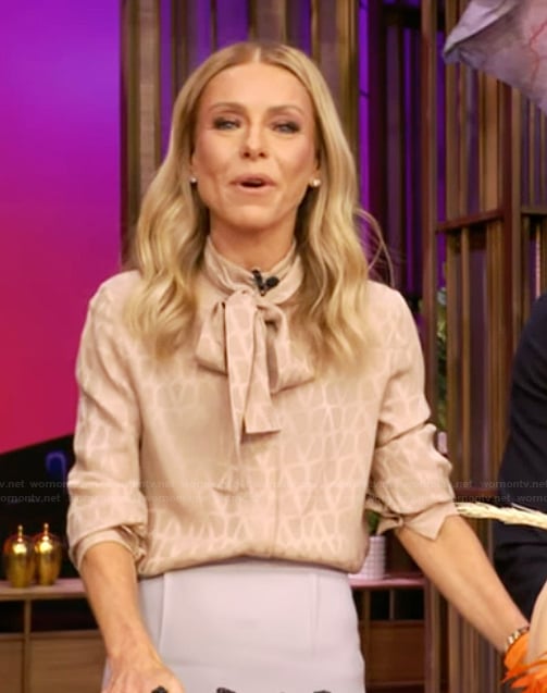 Kelly's beige tie neck blouse on Live with Kelly and Mark
