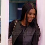 Kiki’s black cropped leather vest and pleated skirt on The Real Housewives of Miami