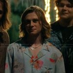 Neil’s blue floral print shirt on The Runarounds