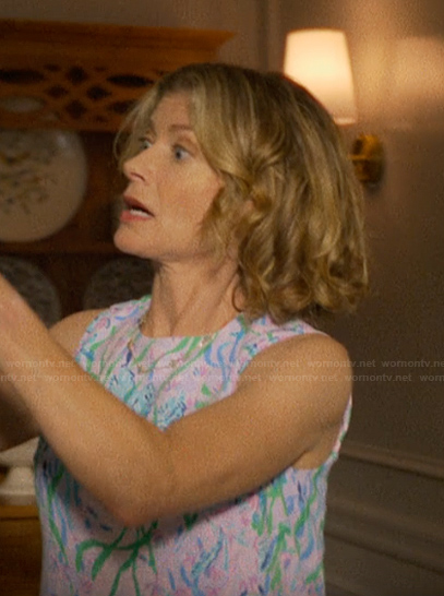 Nora's blue floral print dress on The Runarounds