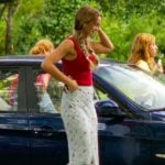 Sophia’s red tank and floral skirt on The Runarounds