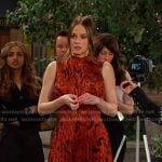 Stephanie’s orange printed pleated dress on Days of our Lives