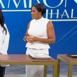 Tamron’s white peplum top and skirt on Tamron Hall Show