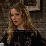 Tessa’s black snake embellished sweatshirt on The Young and the Restless