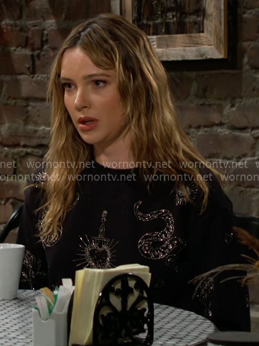 Tessa's black snake embellished sweatshirt on The Young and the Restless