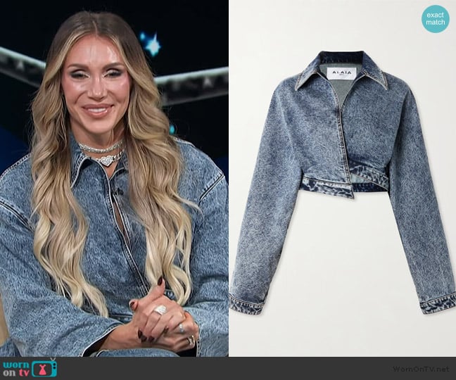 Alaia Cropped asymmetric denim jacket worn by Charlotte Flair on Access Hollywood