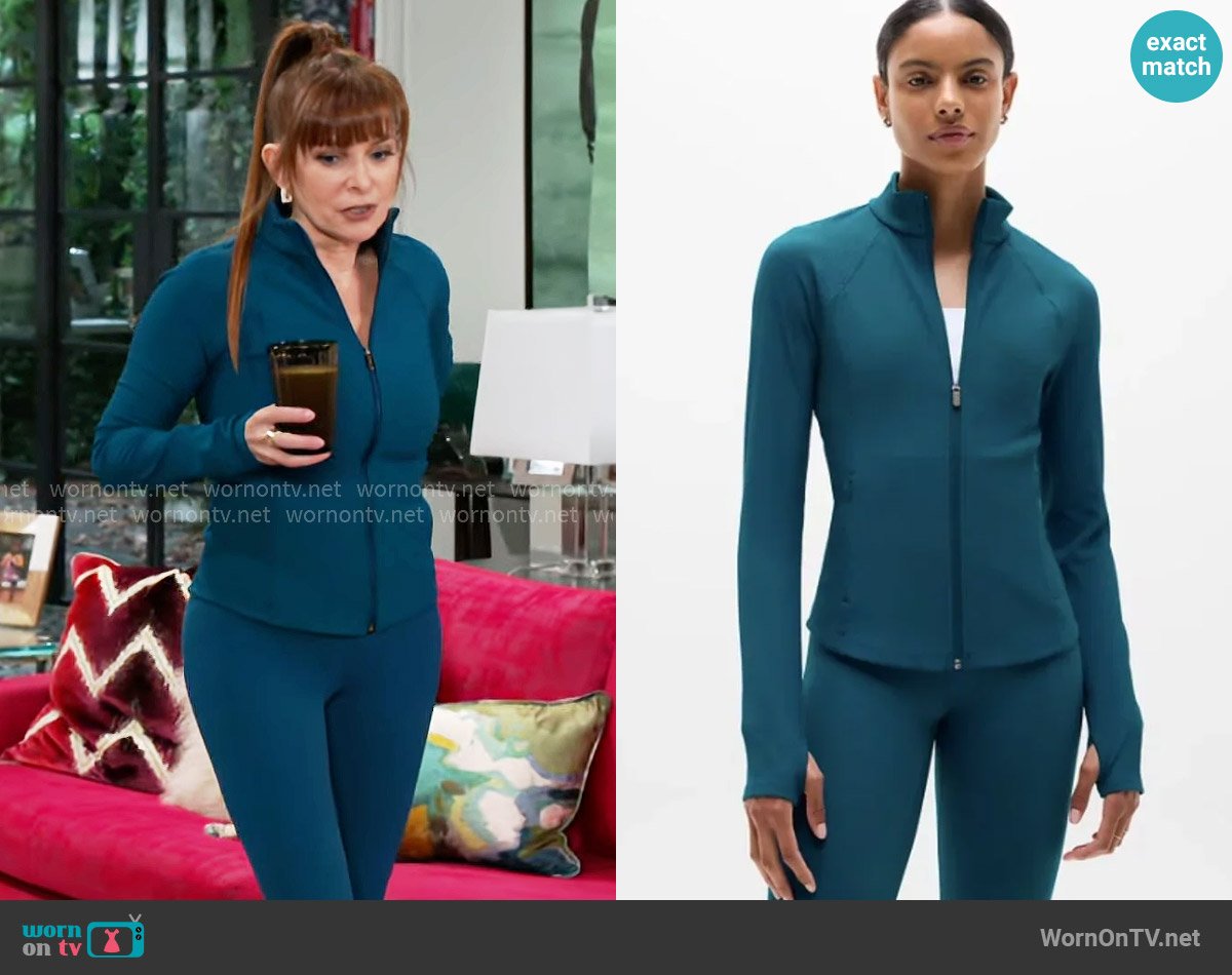Athleta Salutation Jacket 2.0 in Coastal Teal worn by Pamela Curtis (Cady McClain) on Beyond the Gates
