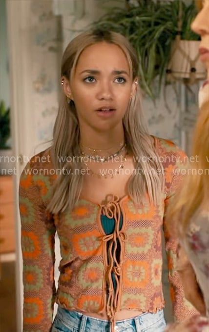 Ava’s orange tie-front cardigan and ripped jeans on High Potential