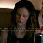 Dr. Caitlin Lenox’s black tie keyhole top on Chicago Med