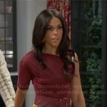 Dani’s burgundy asymmetric top and abstract skirt on Beyond the Gates