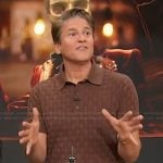 David Burtka’s brown weave polo on Sherri