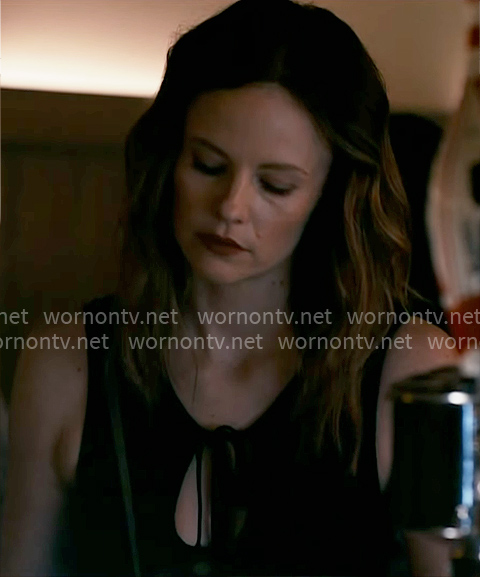 Dr. Caitlin Lenox’s black tie keyhole top on Chicago Med