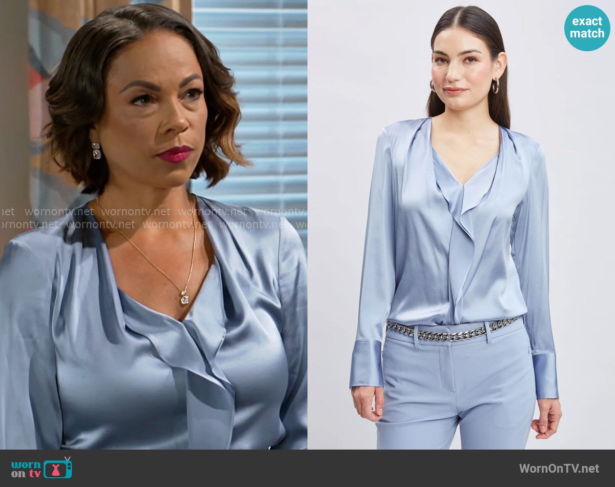 Nicole’s blue satin blouse on Beyond the Gates