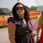 Emily’s navy belted ruffle dress on The Real Housewives of Orange County