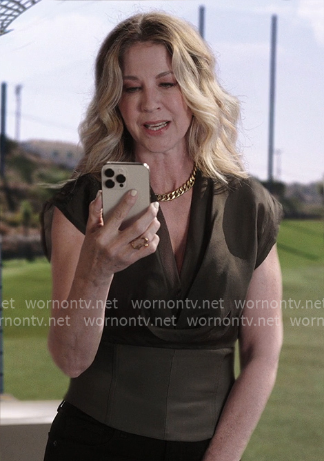 Eve’s olive v-neck top on Shifting Gears