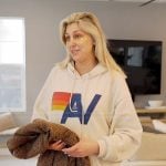 Gina’s beige hoodie on The Real Housewives of Orange County