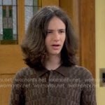 Grover’s brown textured polo shirt on The Neighborhood