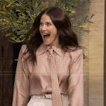 Jackie Tohn’s beige polka dot print tie neck blouse on Live with Kelly and Mark