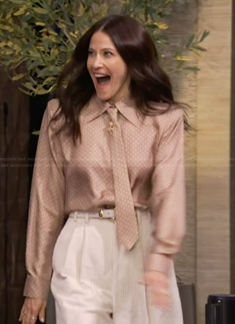 Jackie Tohn’s beige polka dot print tie neck blouse on Live with Kelly and Mark