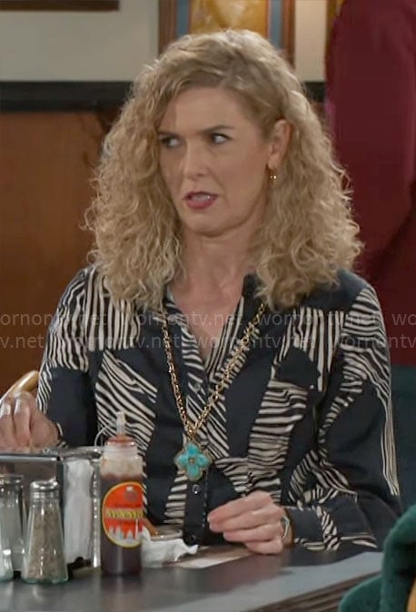 Jan's blue zebra print shirt on Beyond the Gates