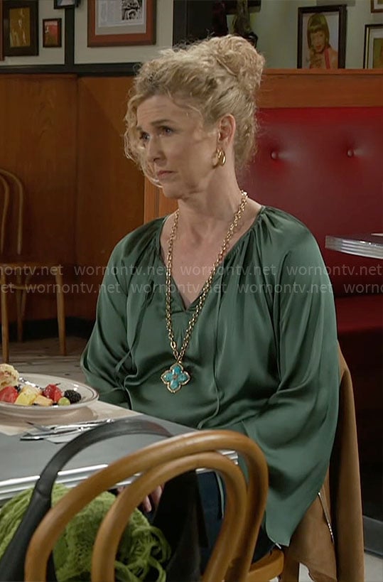 Jan’s green satin blouse on Beyond the Gates