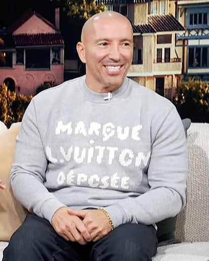 Jason Oppenheim’s gray sweater on Access Hollywood