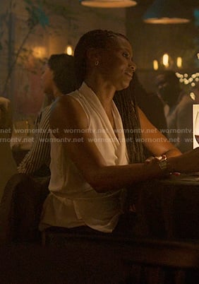 Jax's white sleeveless wrap top on Reasonable Doubt