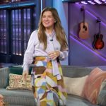 Kelly’s lavender tie neck blouse and printed skirt on The Kelly Clarkson Show