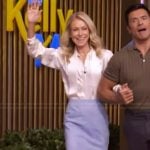 Kelly’s satin tie neck blouse and blue skirt on Live with Kelly and Mark