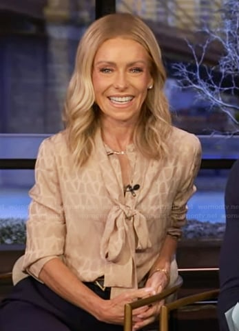 Kelly's beige tie neck blouse on Live with Kelly and Mark