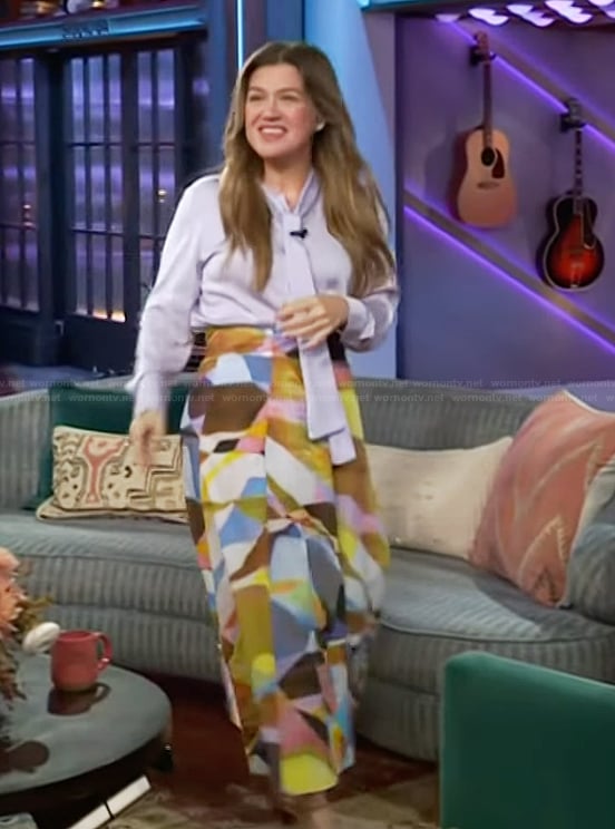 Kelly's lavender tie neck blouse and printed skirt on The Kelly Clarkson Show