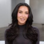 Kim’s black mock neck confessional top on The Kardashians