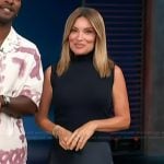 Kit’s navy vest and satin skirt on Access Hollywood