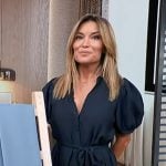 Kit’s navy puff sleeve midi dress on Access Hollywood
