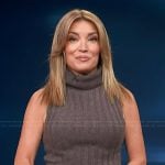 Kit’s brown turtleneck ribbed tank and leather skirt on Access Hollywood