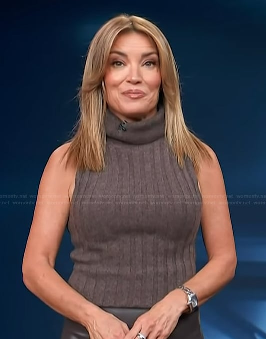 Kit’s brown turtleneck ribbed tank and leather skirt on Access Hollywood